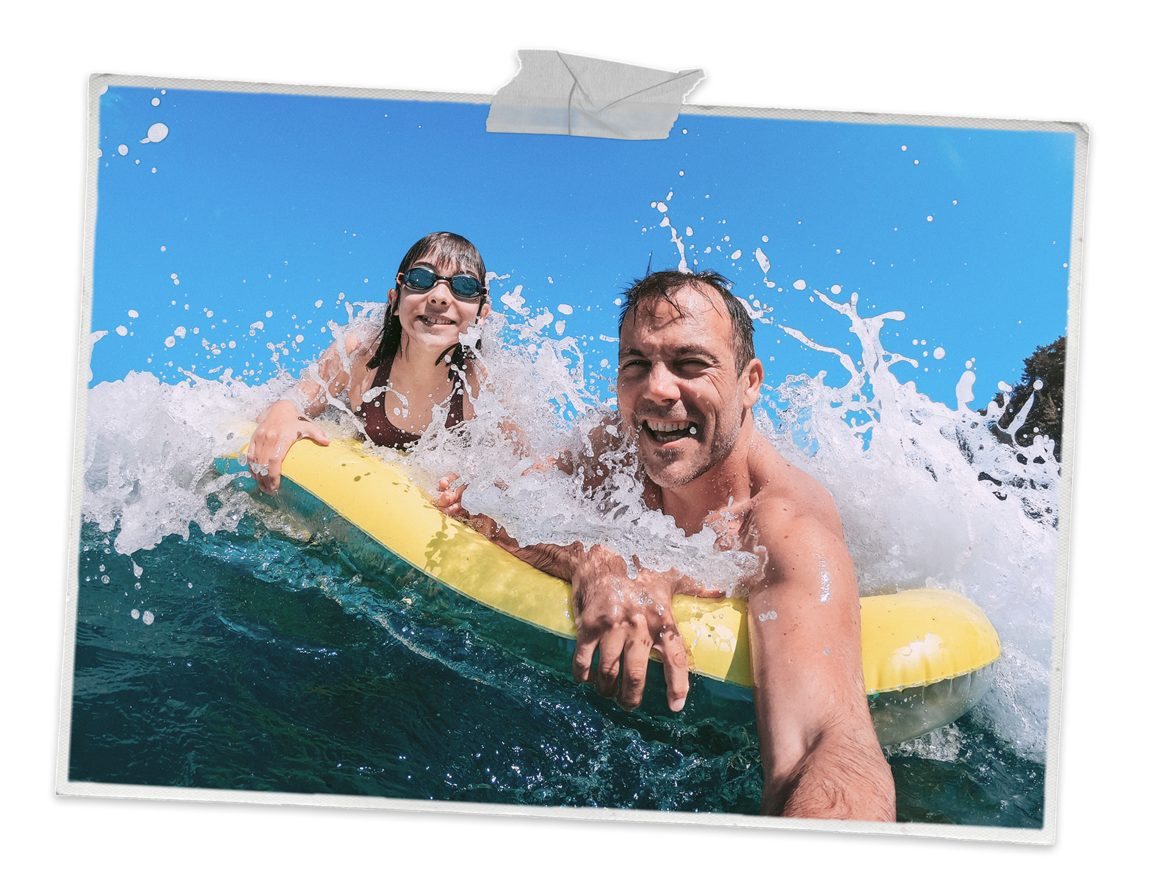 Father and daughter on a rubber dingy in the sea